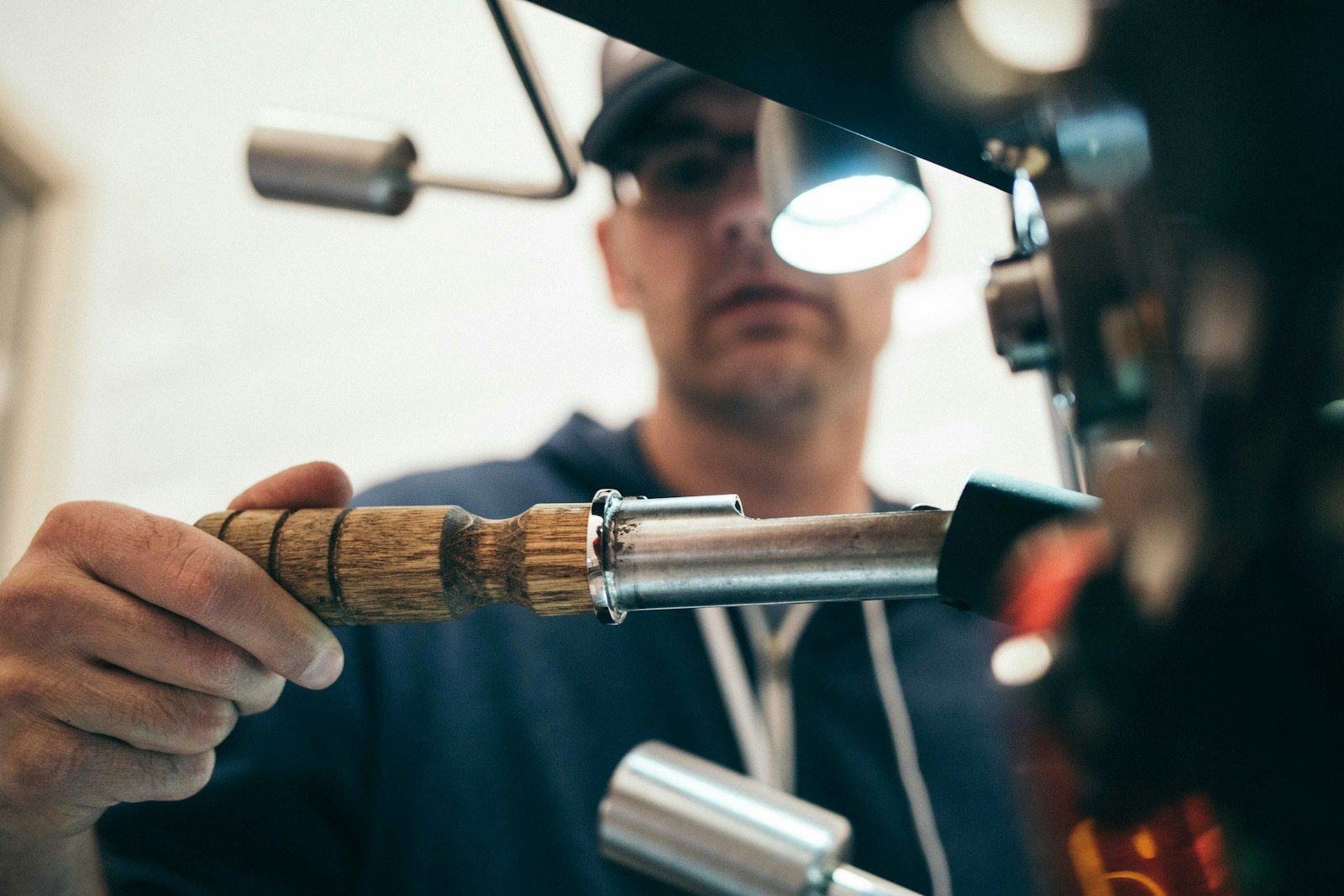 Tradesperson working on pipework with hand tools